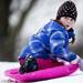 Six-year-old Leah Motowski sleds down the hill at Hunt Park on Friday, Dec. 28. Daniel Brenner I AnnArbor.com